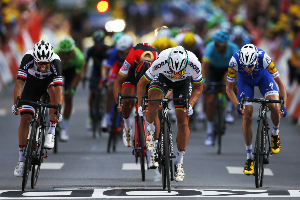 Peter Sagan of Slovakia, center, crosses the finish line
